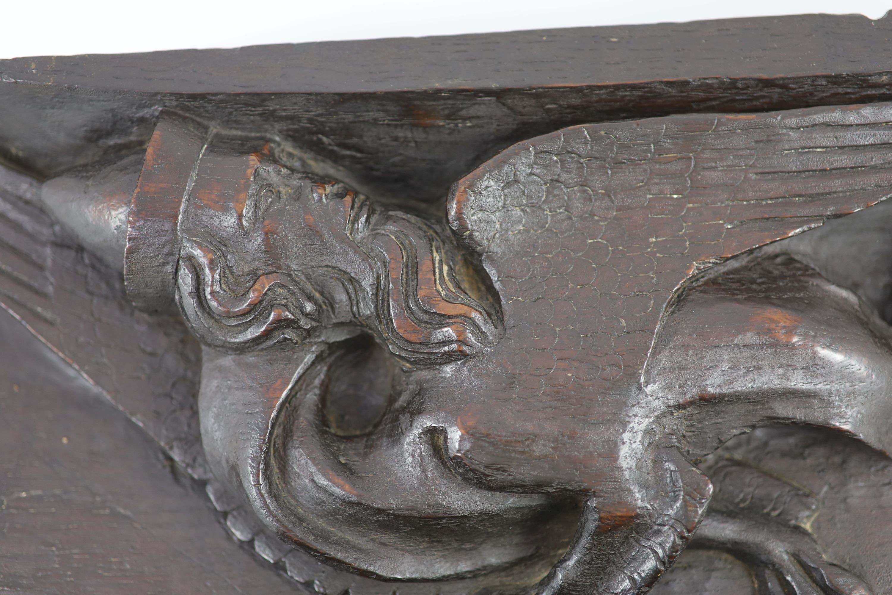 Two carved oak misericord panel fragments, 15th/16th century, the longest 40 x 17cm.